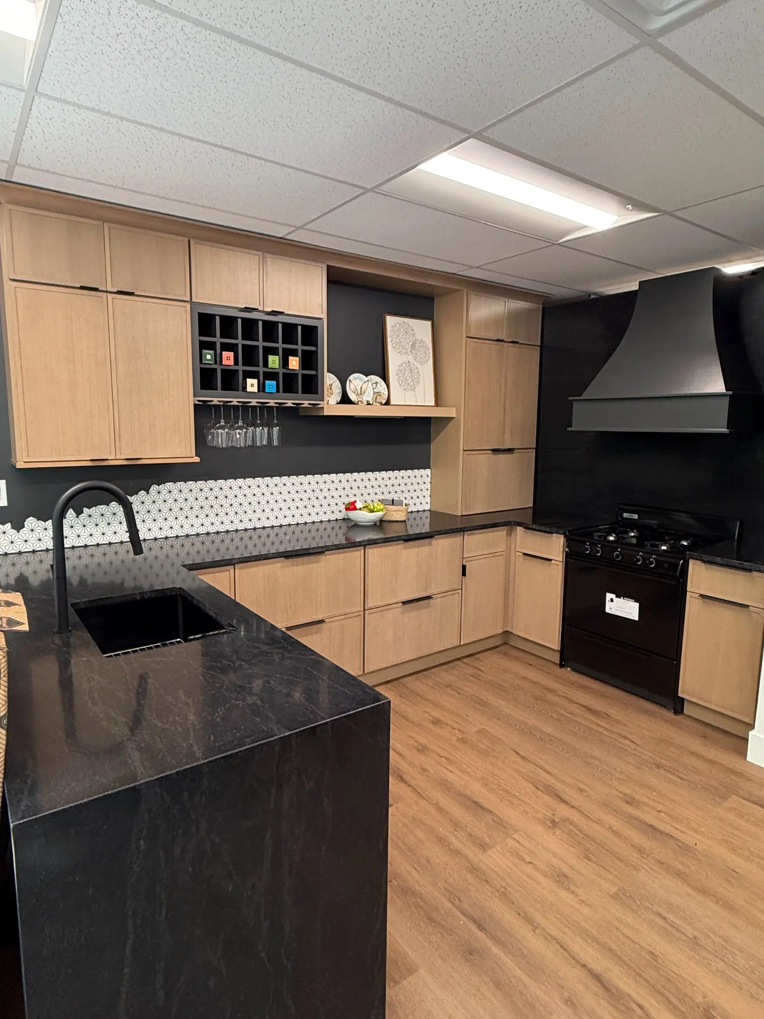 Black stone countertops in a modern wood kitchen